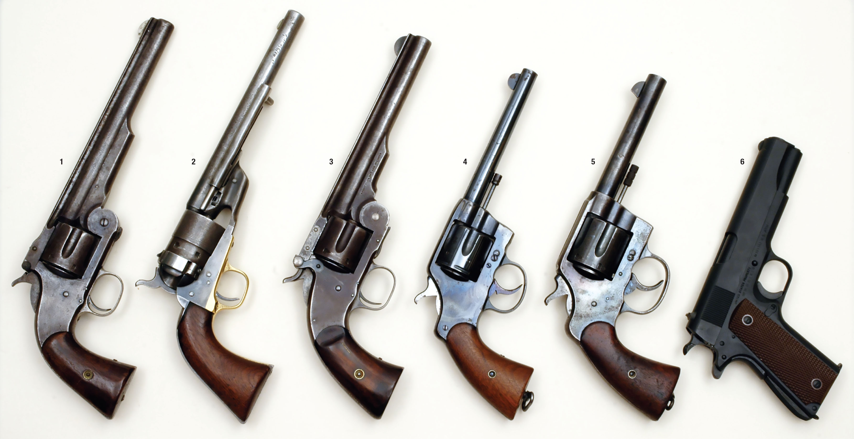 U.S. cavalry handguns: (1) Smith & Wesson No. 3 44 American, (2) Colt Model 1871 44 Colt, (3) Smith & Wesson No. 3 Schofield 45 S&W, (4) Colt Model 1903 38 Long Colt, (5) Colt Model 1909 and (6) Colt Model 1911A1. Missing is a Colt Single Action Army 45.